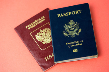 United States passport on top of a Russian passport