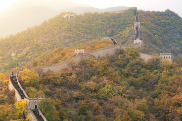Obraz premium China The great wall distant view compressed towers and wall segments autumn season in mountains near Beijing ancient chinese fortification military landmark in Beijing, China.