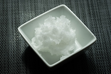 coconut oil on a white ramekin