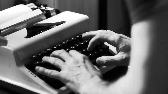 Typing on a vintage typewriter machine. Book writing, film script writing. Writing a love letter by the window, 4K