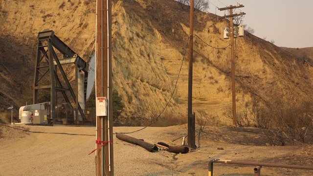 A Telephone Line Is Burned In Half And Destroyed Causing A Power Failure During The Thomas Fire In Ventura County, California.