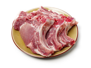 Raw pork ribs on plate isolated on whiteboard