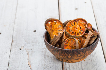 Dry Bael fruit - Slices of dry Bael fruit on the wooden table
