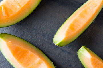 Melon slice on rock plate