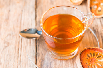 Bael tea juice on wooden table , healthy drink