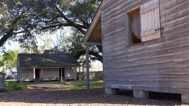 Wooden cabins used by slaves still stand on a plantation in the deep south.