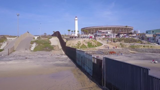 Good aerial of the U.S. Mexico border fence in the Pacific Ocean between San Diego and Tijuana.