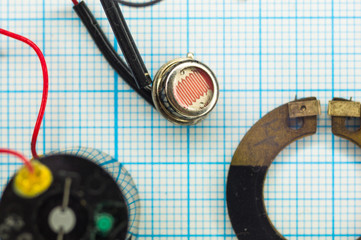 parts old retro film SLR camera on graph paper