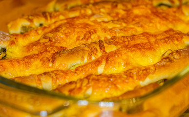 baked In the oven homemade pie stuffed with cheese and mushrooms