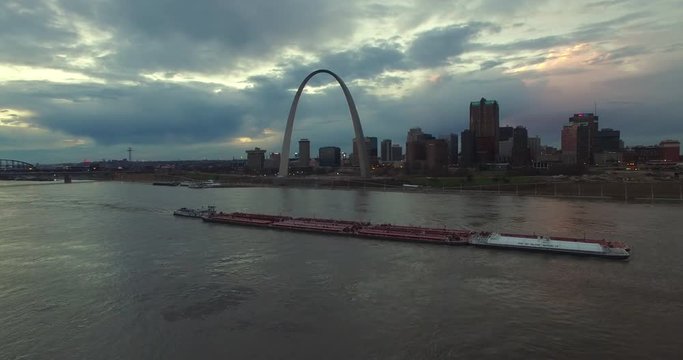 Beautiful aerial over a Mississippi river barge with the St. Louis, Missouri skyline background.