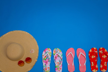Summer Event Background with beach hat, sunglasses and flip flops for using in ads for summer...