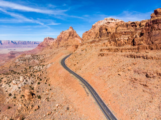 Scenic asphalt road in Grand Canyon mountains at hot summer day. Aerial view.