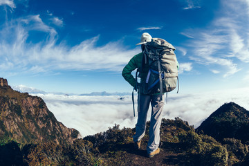 successful hiker in the beautiful landscape on mountain top