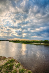 Summer landscape with river and sky in the clouds