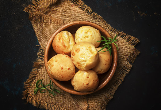 Homemade cheese buns, rustic style, vintage wooden background, top view