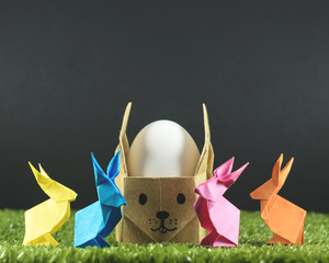 Easter eggs and colorful Easter bunnies, origami, accessories for cards and congratulations with Easter. - 196588540