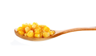 corn in spoon on white background
