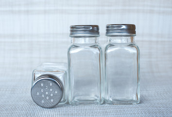 three empty bottle for spices powder.