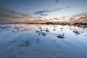 Sunset seascape with natural coastal rocks  at Kudat, Sabah Malaysia.