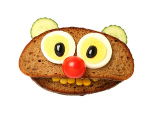 Funny bear made with bread, egg and vegetables