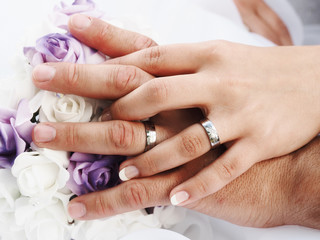 still life with wedding bouquet and wedding rings