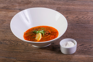 Solyanka soup with lemon