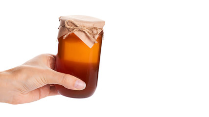 eco home made honey in jar in hand isolated on white background. copy space, template