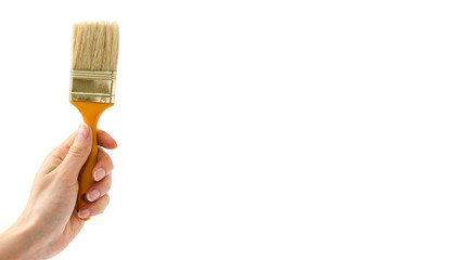 female hand holding paintbrush. Isolated on white background. copy space, template.