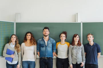 Line of six university students in the classroom