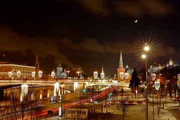 Fototapeta na wymiar Moscow Kremlin With Illumination Of Cars On Road in the winter , Russia