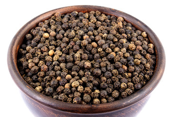Black pepper in bowl isolated on white background