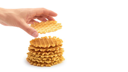 female hand holds homemade crisp Waffle. isolated on white background. copy space, template