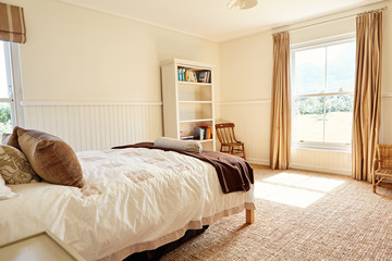 Fototapeta premium Interior of the bright bedroom in a country home