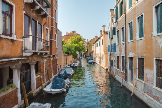Venice, beautiful romantic italian city on sea with great canal and gondolas. View of venetian narrow canal. Venice is a popular tourist destination of Europe.