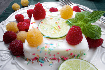 Sweet delicious panna cora dessert with chocolate and raspberries