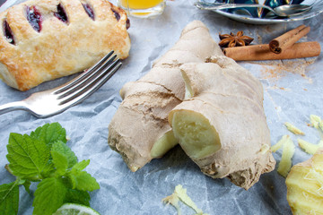 Fresh raw ginger with grated pieces and fruit cake