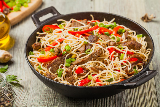 Chinese pasta with beef. Prepared in wok.