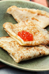 Sourdough pancakes with red salmon caviar