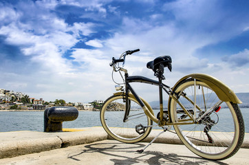 Fototapeta na wymiar Vintage style bicycle standing on Pier of marina Zeas, Piraeus Greece .