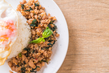 stir-fried pork with basil  on rice and fried egg
