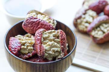 Closeup of red date stuffed with walnut