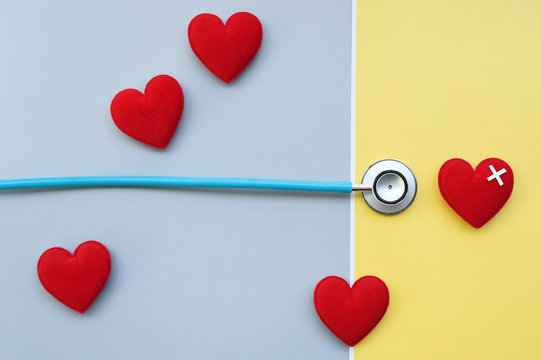 Red heart with stethoscope for background