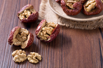 Fototapeta na wymiar Closeup of red date stuffed with walnut