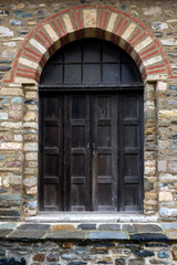 Fototapeta na wymiar Door of an old abandoned building