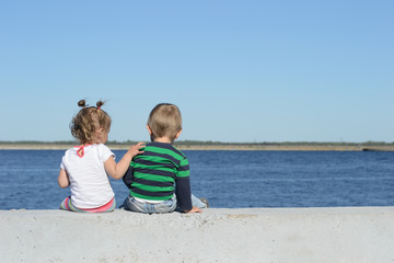 Fototapeta premium the sister laid her hand on her brother's shoulder