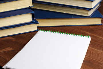 books and a blank sheet of notepad on the spring, a place for reading the books read
