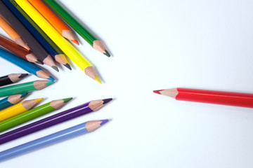 Business concepts: red crayon standing out from the crowd