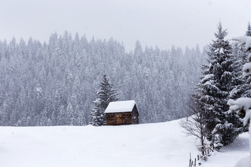 Wooden barn on Romanian mountains at winter