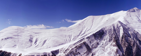 Panorama of a snow-covered mountain range