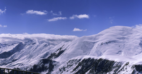 Fototapeta na wymiar Panorama of a snow-covered mountain range